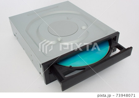 Opened CD - DVD drive with blue disk inside. 73948071