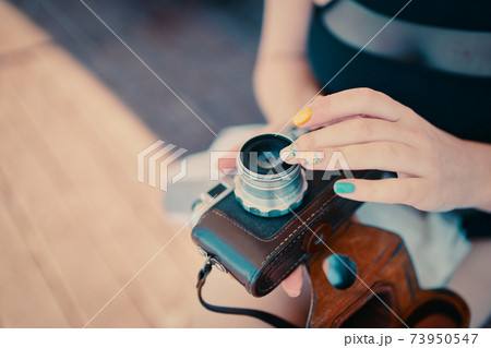 Vintage camera in hand. Vintage camera in hand. 73950547