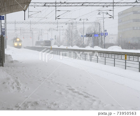 the train arrives at the station during a blizzard the train arrives at the station during a blizzard 73950563