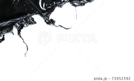 Plastic wrap. Black shiny film bag pattern isolated on white with copy space. Transparent dark cellophane texture. Creative crumpled background. Plastic wrap. Black shiny film bag pattern isolated on white with copy space. Transparent dark cellophane texture. Creative crumpled background. 73952592
