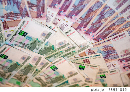 Russian rubles. Randomly scattered banknotes Russian rubles. Randomly scattered banknotes 73954016
