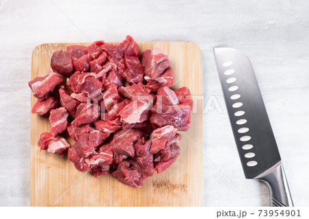 Fresh meat cut into thin pieces on wooden board 73954901