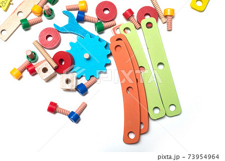 Closeup of colorful wooden construction toy on white background 73954964