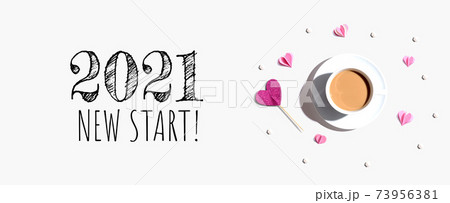 2021 New Start message with a cup of coffee and paper hearts 73956381