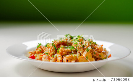 Piri piri style chicken on a bed of wholewheat pasta and vegetables, with a cool sour cream and chive dressing Piri piri style chicken on a bed of wholewheat pasta and vegetables, with a cool sour cream and chive dressing 73966098