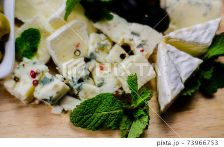set of different cheeses on a wooden board, cheese board, delicious snack, healthy and exclusive food 73966753