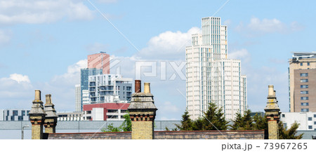 Typical English chimneys on the roofs of London buildings Typical English chimneys on the roofs of London buildings 73967265