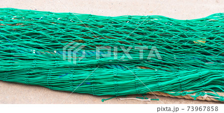 Industrial Fishing Equipment Fishnets and Fishing Lines Lying on