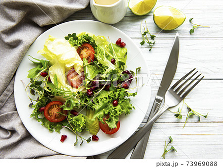 Fresh green mixed salad bowl Fresh green mixed salad bowl 73969088