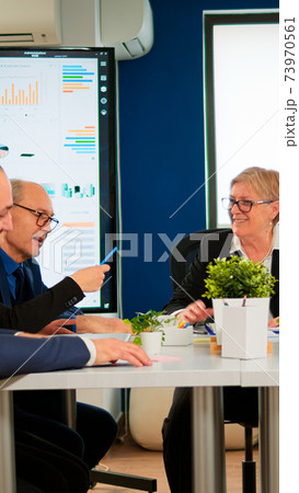 Senior woman manager waiting team for business conference Senior woman manager waiting team for business conference 73970561
