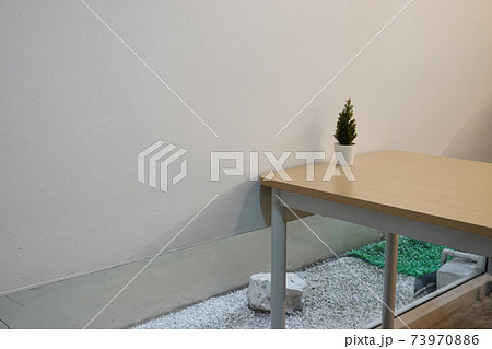 japan style livingroom with wooden table and small plant pot. japan style livingroom with wooden table and small plant pot. 73970886
