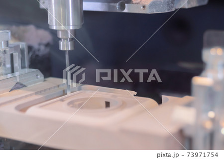 Milling machine cutting wooden workpiece from wood pulp at technology exhibition 73971754
