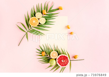 Female hand holding half coconut on white background. flat lay, top view 73976849