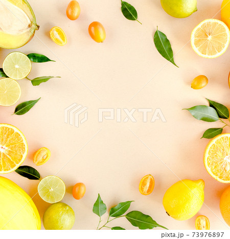 Frame made of summer tropical fruits: orange, lemon, lime, mango on yellow background. Food concept. flat lay, top view Frame made of summer tropical fruits: orange, lemon, lime, mango on yellow background. Food concept. flat lay, top view 73976897