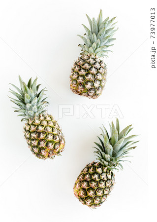 Pineapples isolated on white background. Food concept. Flat lay, top view 73977013
