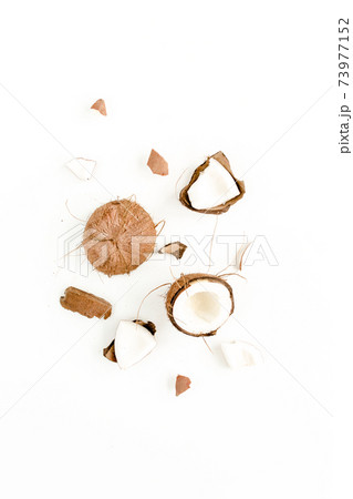 cracked coconut on white background. flat lat, top view cracked coconut on white background. flat lat, top view 73977152