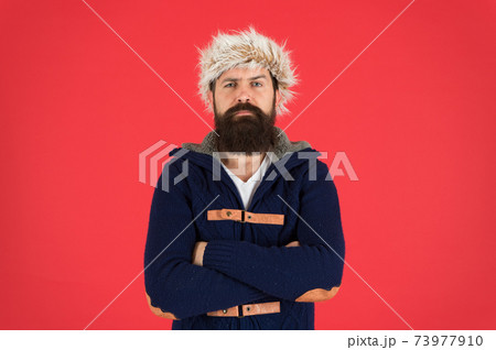 Clothes design. Man bearded stand warm jumper and hat  73977910