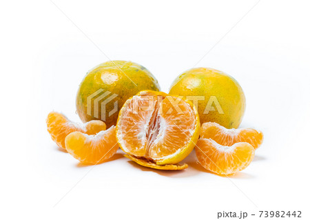 Peeled and unpeeled of juicy Orange Tangerine fruit isolated on white background. 73982442