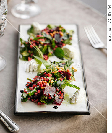 Closeup gourmet appetizer beet salad with cheese 73985254
