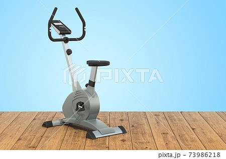 Stationary exercise bike on the wooden planks, 3D rendering Stationary exercise bike on the wooden planks, 3D rendering 73986218