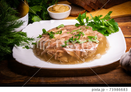 Traditional Russian meat aspic with mustard. Jellied meat. Traditional Russian meat aspic with mustard. Jellied meat. 73986683