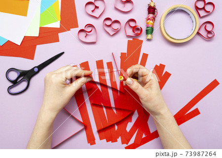 DIY instruction. Step by step guide. The process of making a garland of hearts for Valentine's Day 73987264