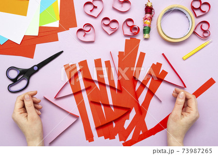DIY instruction. Step by step guide. The process of making a garland of hearts for Valentine's Day 73987265