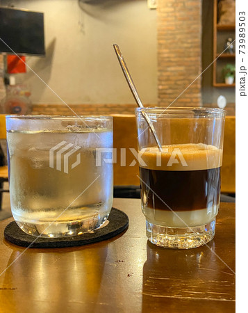 Vertical photo of Vietnamese fin coffee with condensed milk Vertical photo of Vietnamese fin coffee with condensed milk 73989503