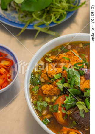 Bowl of delicious Bun Rieu noodle - Vietnamese cuisine Bowl of delicious Bun Rieu noodle - Vietnamese cuisine 73989505