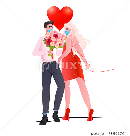 man woman in masks standing together couple celebrating valentines day coronavirus quarantine concept man woman in masks standing together couple celebrating valentines day coronavirus quarantine concept 73991764