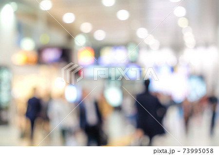 Blurred people in train station 73995058