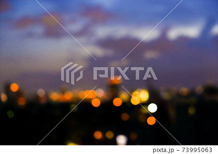 Blurred colorful sunset sky cloud with city building 73995063