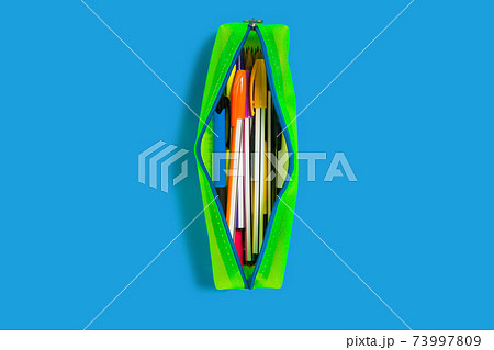 yellow pencil case on a blue surface 73997809