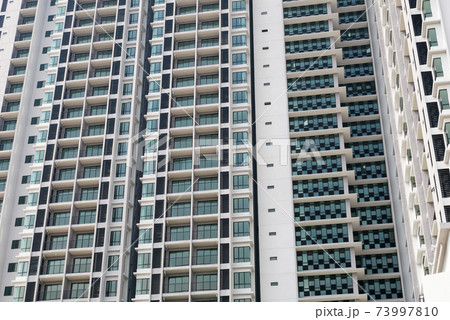 SELANGOR, MALAYSIA -JULY 22, 2020: High rise apartment building with modern facade design. Popular in the urban areas in Malaysia. Various facilities for the use of the residents are provided. 73997810