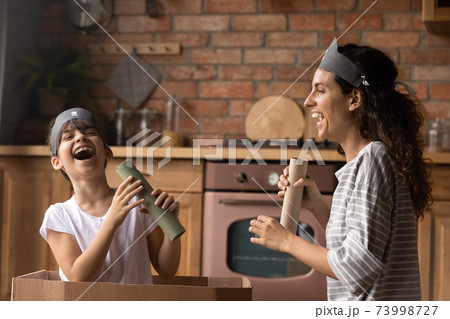 Close up overjoyed little girl and mother playing pirates together 73998727