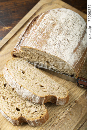 Fresh bread slice and cutting Fresh bread slice and cutting 74000272