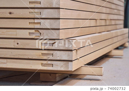 Joinery. Wood door manufacturing process. Stacked door leafs. Furniture manufacture Joinery. Wood door manufacturing process. Stacked door leafs. Furniture manufacture 74002732