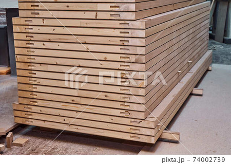 Joinery. Wood door manufacturing process. Stacked door leafs. Furniture manufacture 74002739