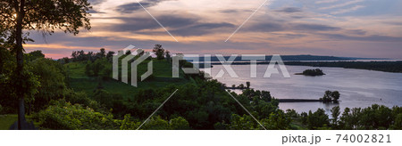 Dnipro river summer evening view from Taras Hill or Chernecha Hora (Monk Hill - important landmark of the Taras Shevchenko National Preserve, Kaniv, Cherkasy Region, Ukraine. Dnipro river summer evening view from Taras Hill or Chernecha Hora (Monk Hill - important landmark of the Taras Shevchenko National Preserve, Kaniv, Cherkasy Region, Ukraine. 74002821