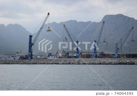 Port Akdeniz. Colorful containers and crane working on the harbor Antalya, 74004395