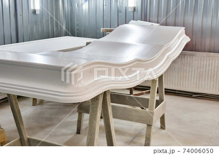 Classic wardrobe crown molding. Production of wood furniture. Furniture manufacture Classic wardrobe crown molding. Production of wood furniture. Furniture manufacture 74006050