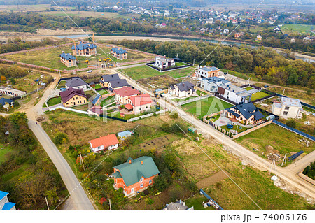 Aerial view of home roofs in residential rural neighborhood area. 74006176