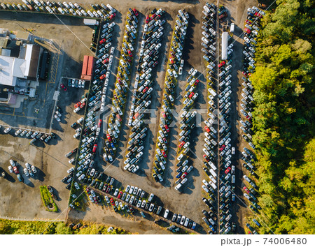 Many used car auction lot parked distributed in a parking. 74006480