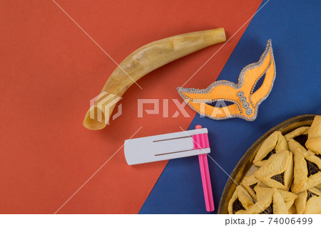 Hamans ears cookies noisemaker and mask for Purim celebration jewish carnival holiday Hamans ears cookies noisemaker and mask for Purim celebration jewish carnival holiday 74006499