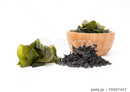 Dried and fresh seaweed wakame isolated on white background. Japanese food Dried and fresh seaweed wakame isolated on white background. Japanese food 74007447