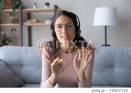 Web camera view smart young caucasian woman holding video call. 74007539
