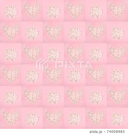 Festive floral seamless pattern of pink squares with shapes heart and circle laid out from white apple tree flowers. Holiday Mother's day, Valentine's Day, Wedding backdrop. Top view, flat lay. 74008983