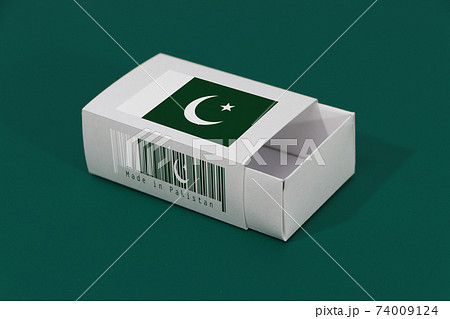 Pakistan flag on white box with barcode and the color of nation flag on green background 74009124