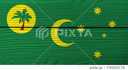 Flag of Cocos (Keeling) Islands on wooden wall background. Grunge Cocos flag texture 74009276