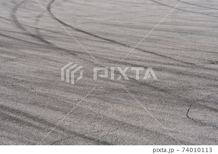 Asphalt with black rubber marks from tyres Asphalt with black rubber marks from tyres 74010113